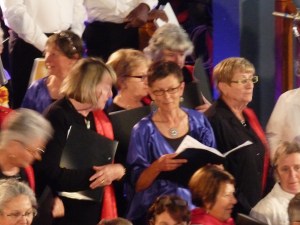 There we are, members of 5 different choirs, all in our different concert gear, squeezing together to begin singing.  That's me in the middle, in blue.
