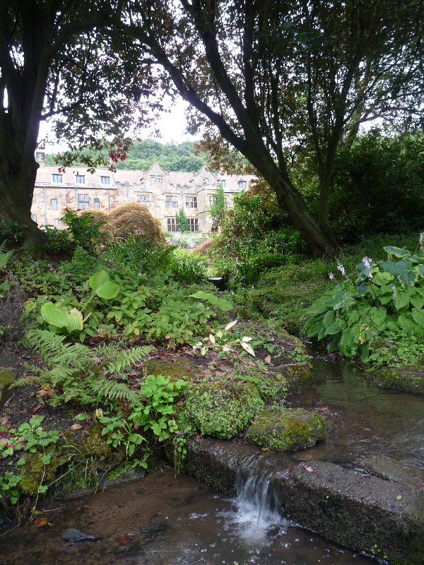 This is the Manor House as it appears today, viewed from the garden and fishpond.