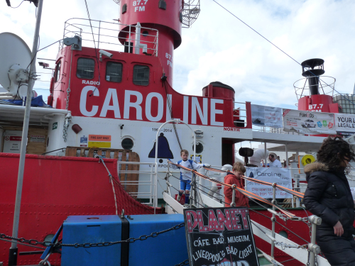 Alex and Ben rush down the gangplank of the pirate ship.
