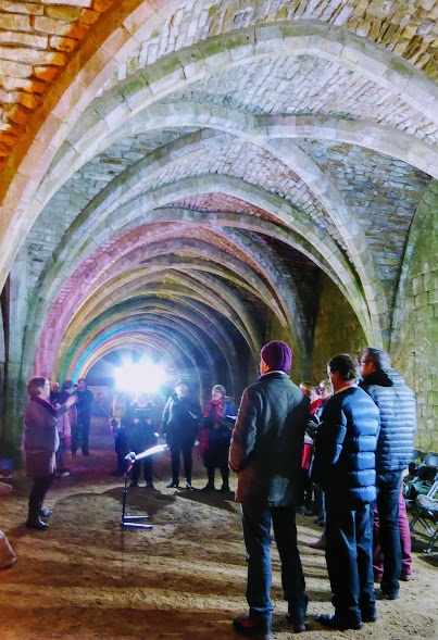 Choir in winter woollies.  It's cold in the cellarium.