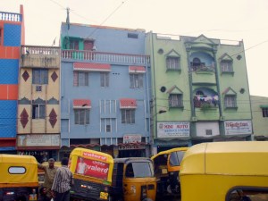 A back street in Bangalore, and a few rickshaws.